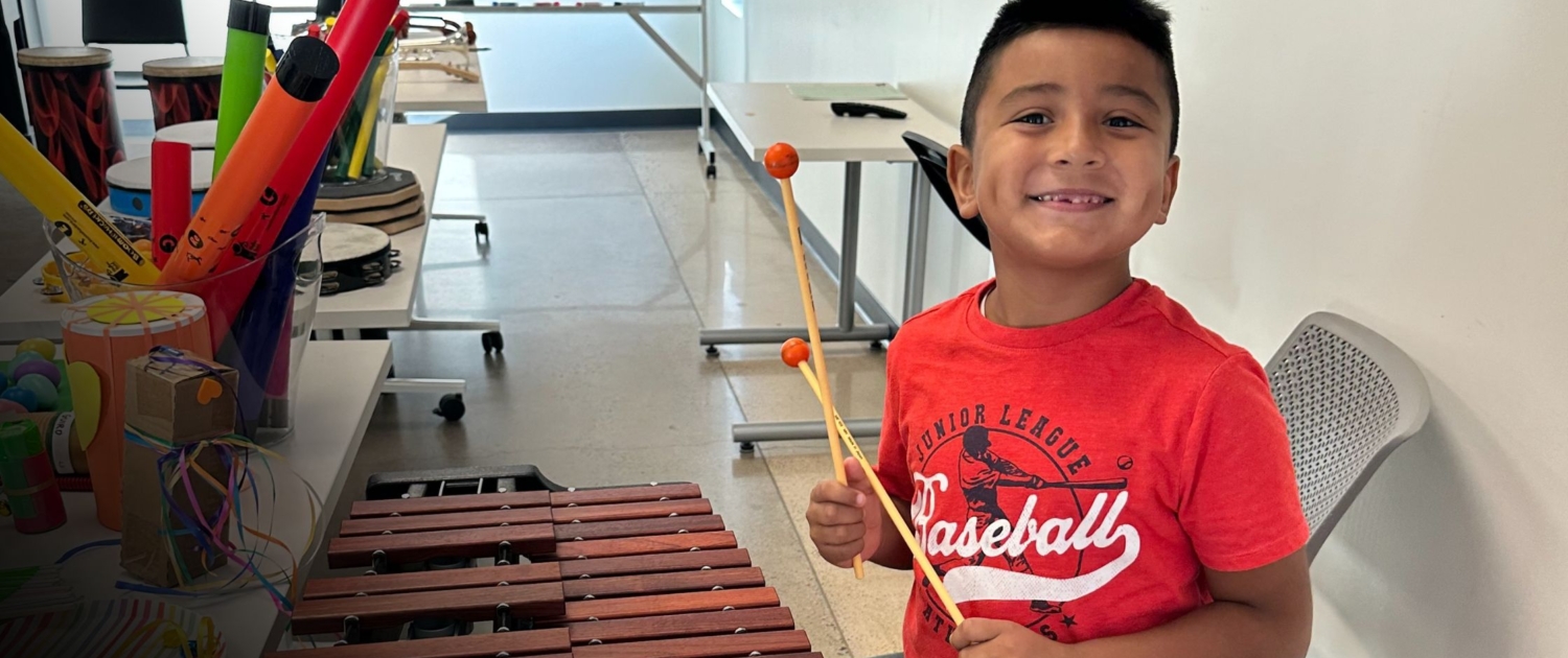 Youth playing xylophone